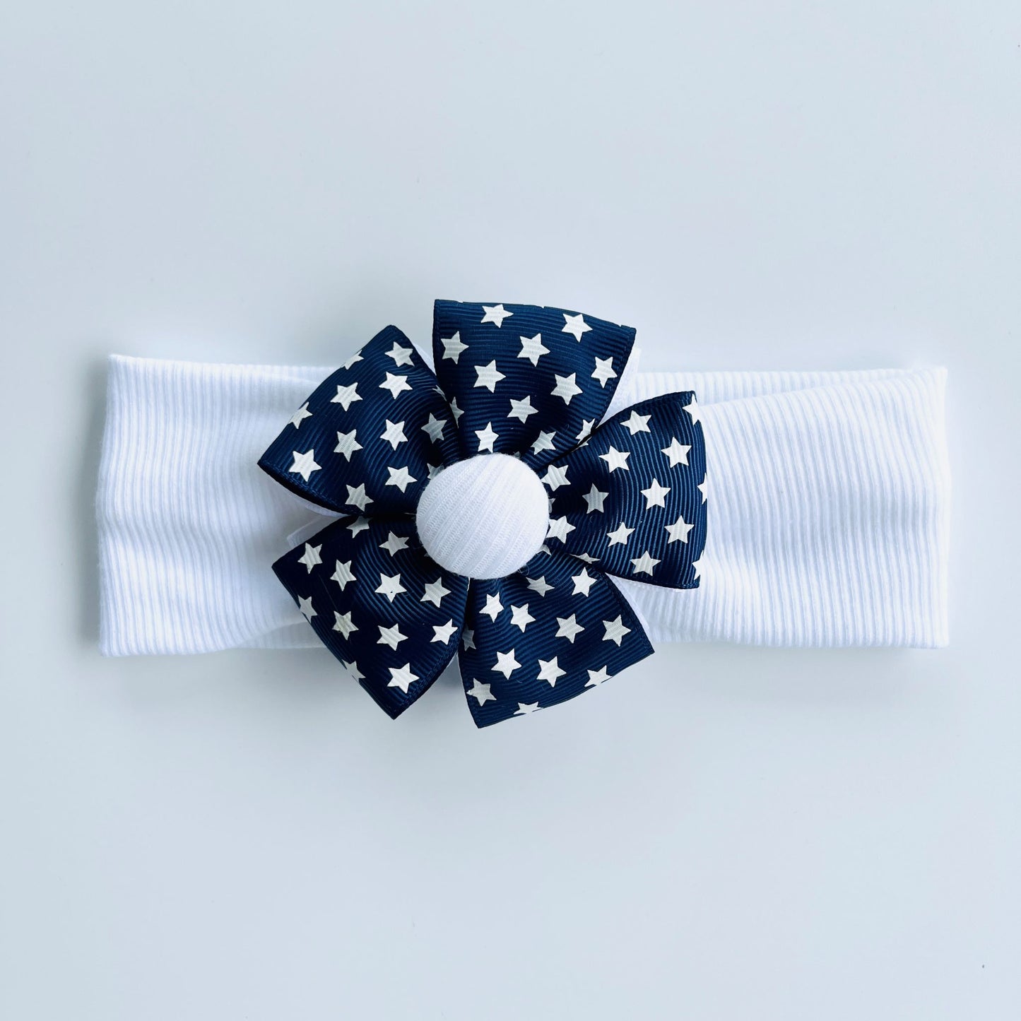 White Headband With White Stars Printed Dark Blue Ribbon Flower