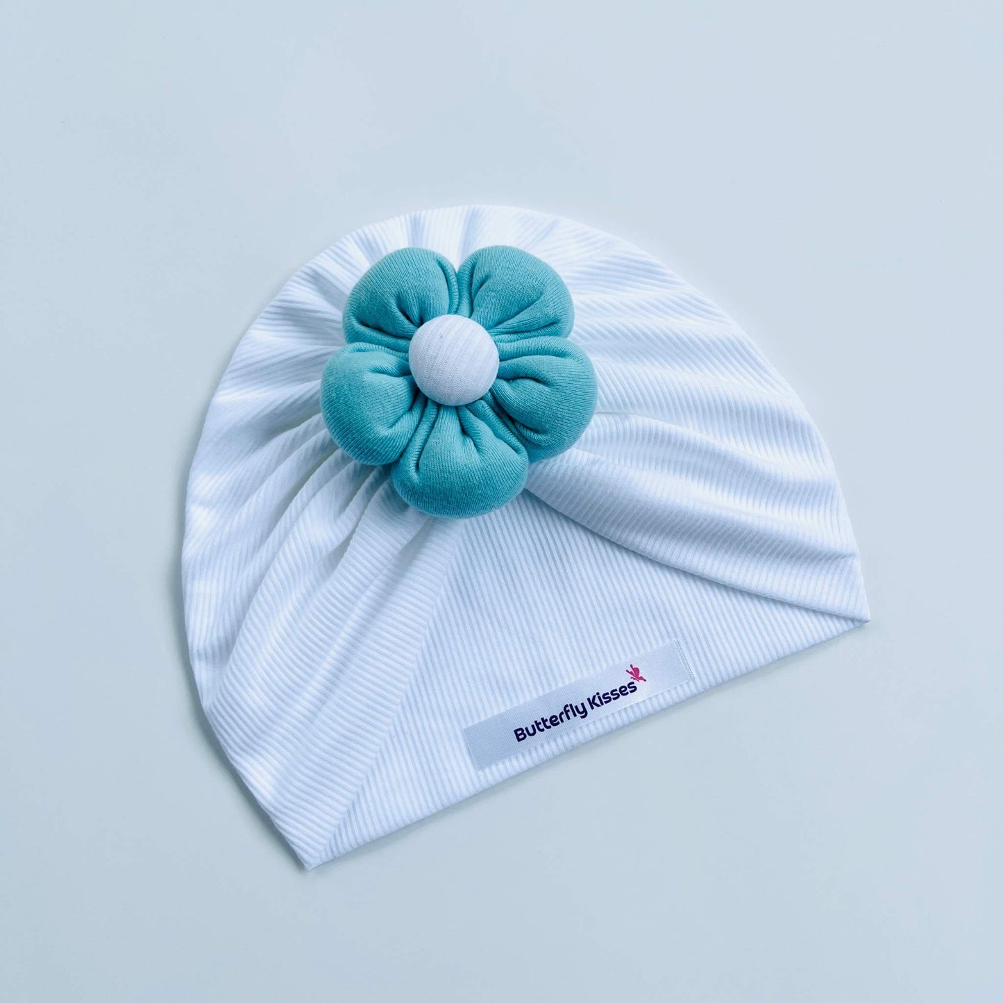 White Baby Turban with Puffy Flower in Red, Blue, Yellow & Pink