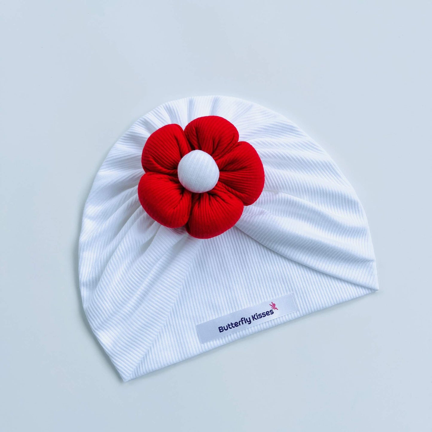White Baby Turban with Puffy Flower in Red, Blue, Yellow & Pink